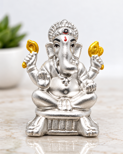 999 Pure Silver Ganesha Idol with Two Yellow Flowers