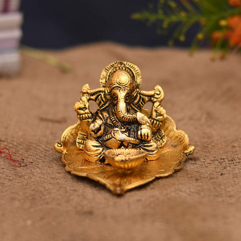 Golden Lord Ganesha With Diya On Leaf Handcrafted Metal Showpiece (D11)