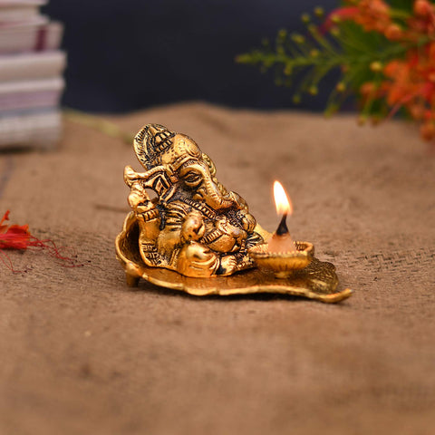 Golden Lord Ganesha With Diya On Leaf Handcrafted Metal Showpiece (D11)